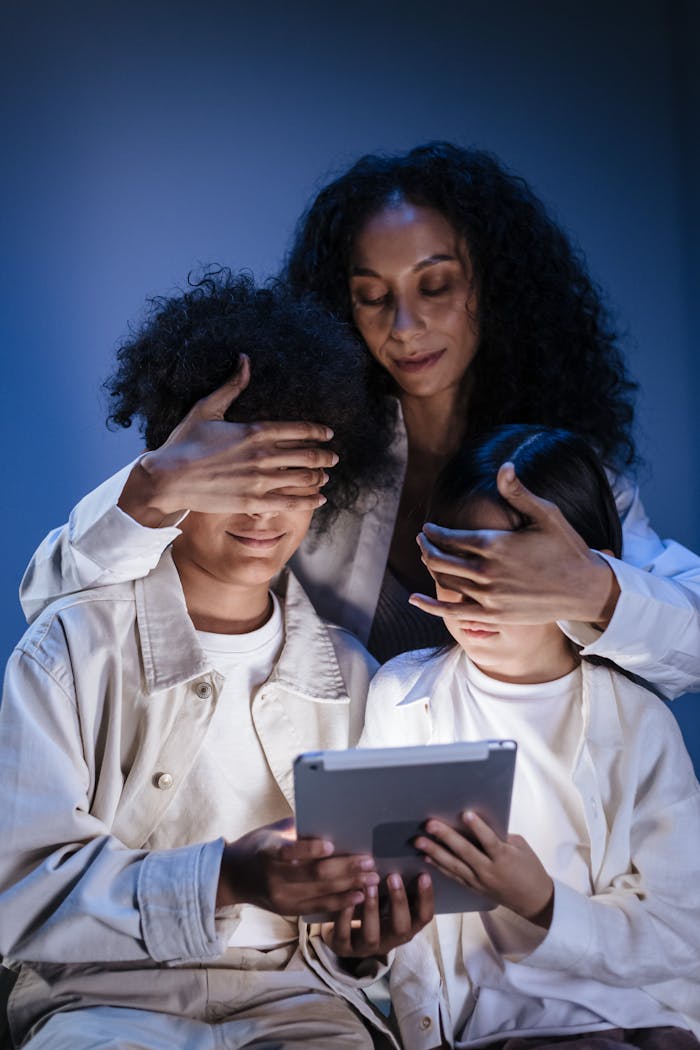 Mastering the First Impression: Your intriguing post title goes here A mother supervises two children using a tablet, promoting digital safety and responsible media use.